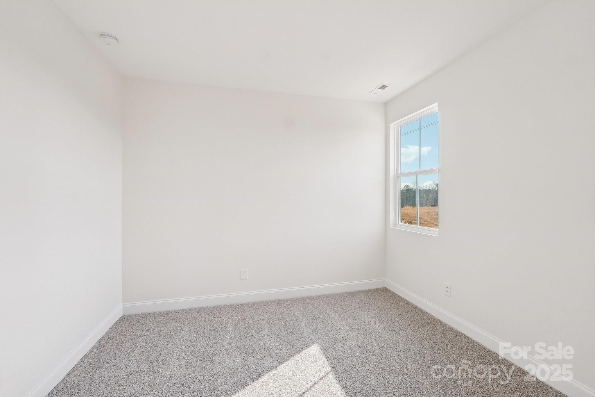 817 Terra Drive Tega Cay, SC 29708 - Photo 21 of 38 a view of an empty room with a window
