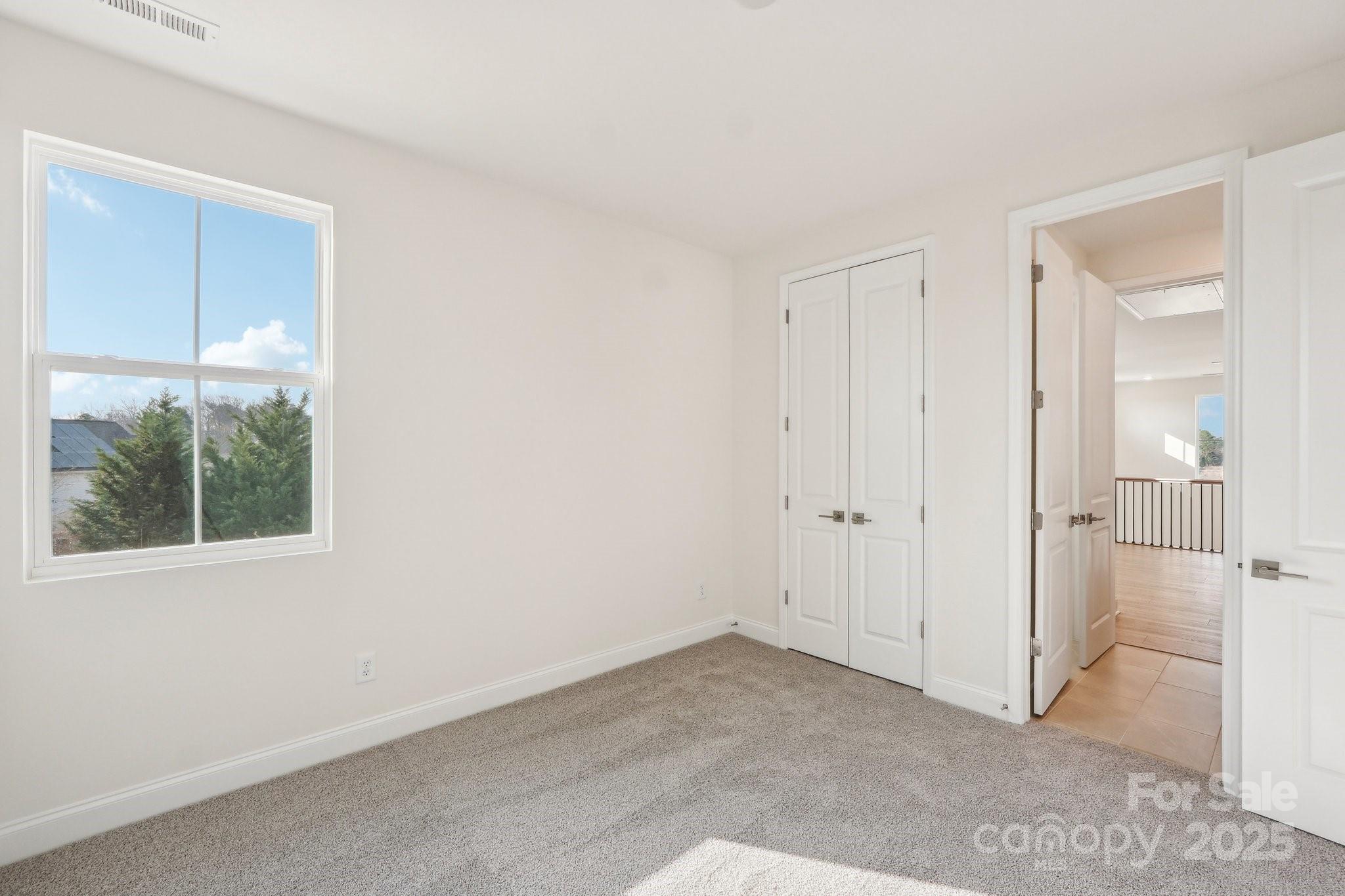 817 Terra Drive Tega Cay, SC 29708 - Photo 22 of 38 a view of an empty room with a window