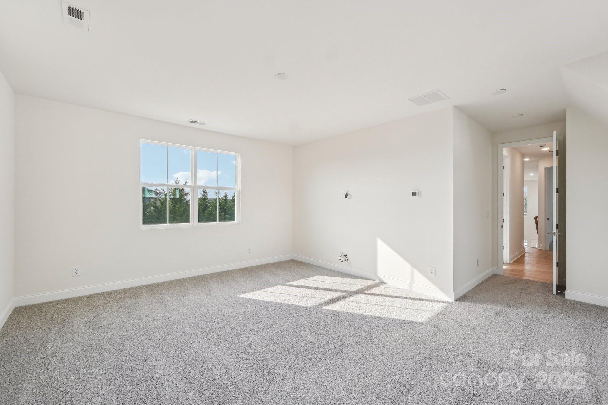 817 Terra Drive Tega Cay, SC 29708 - Photo 25 of 38 an empty room with windows