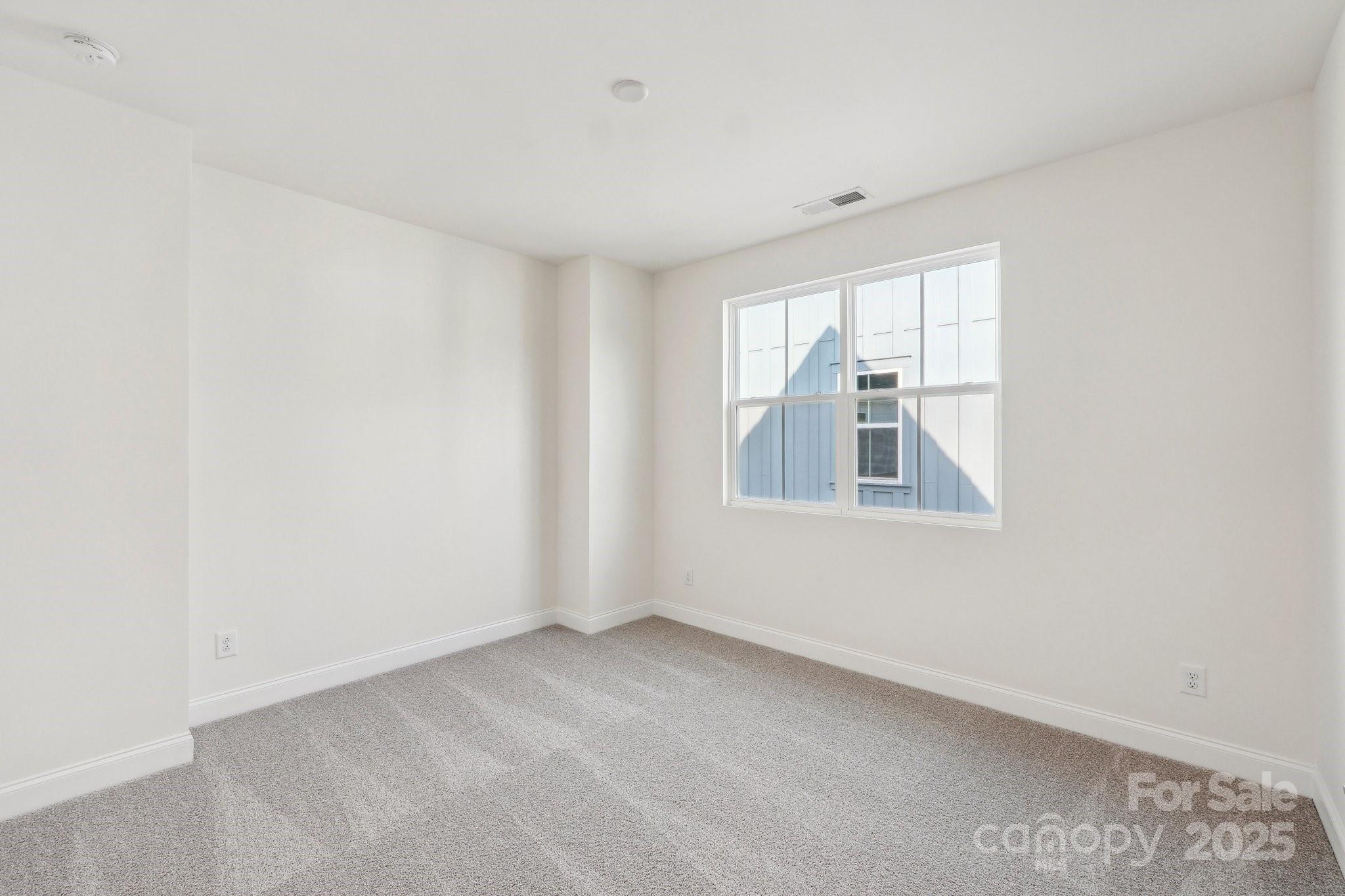 817 Terra Drive Tega Cay, SC 29708 - Photo 26 of 38 a view of an empty room with a window