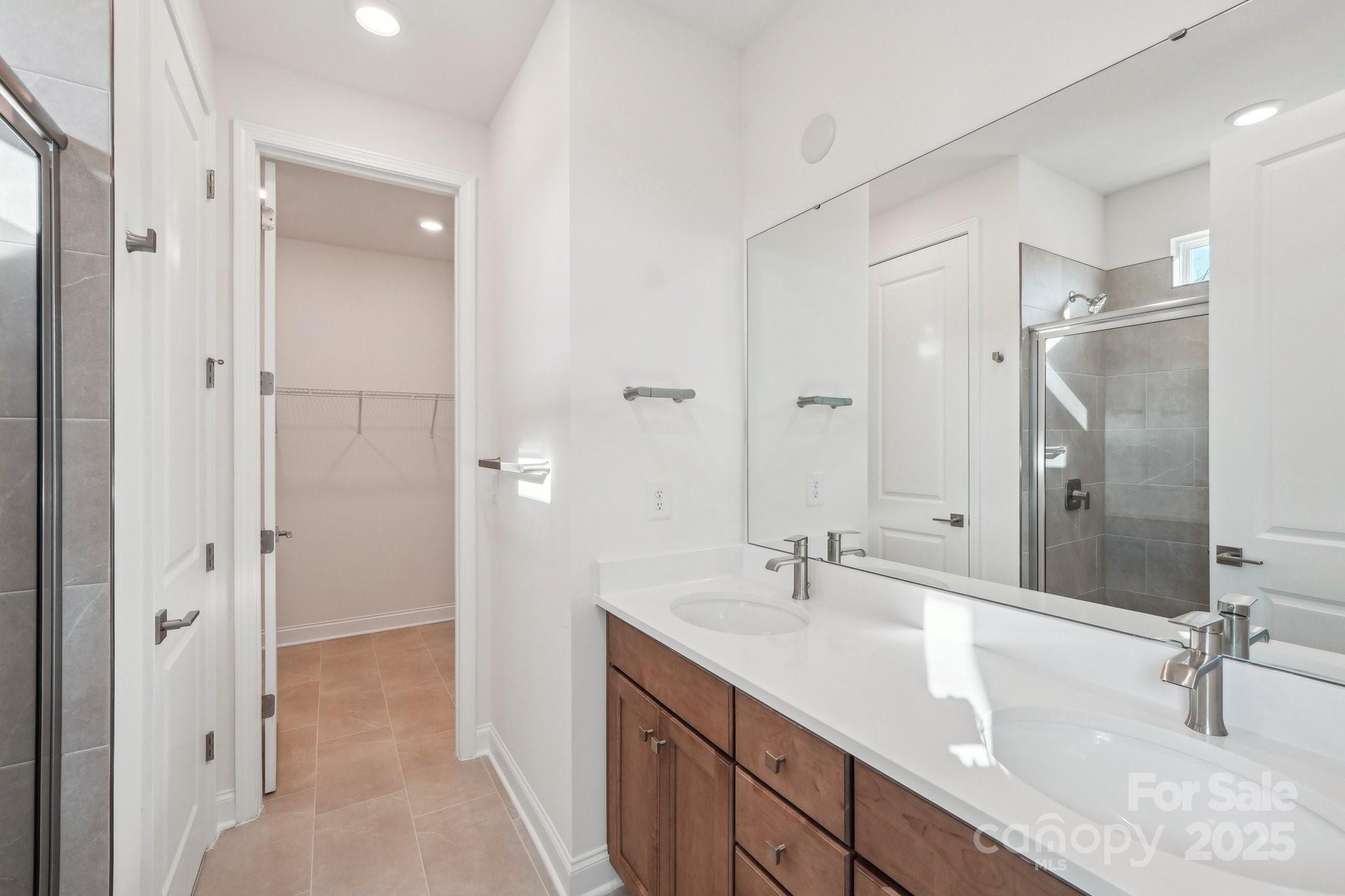 817 Terra Drive Tega Cay, SC 29708 - Photo 6 of 38 a bathroom with a double vanity sink mirror and double