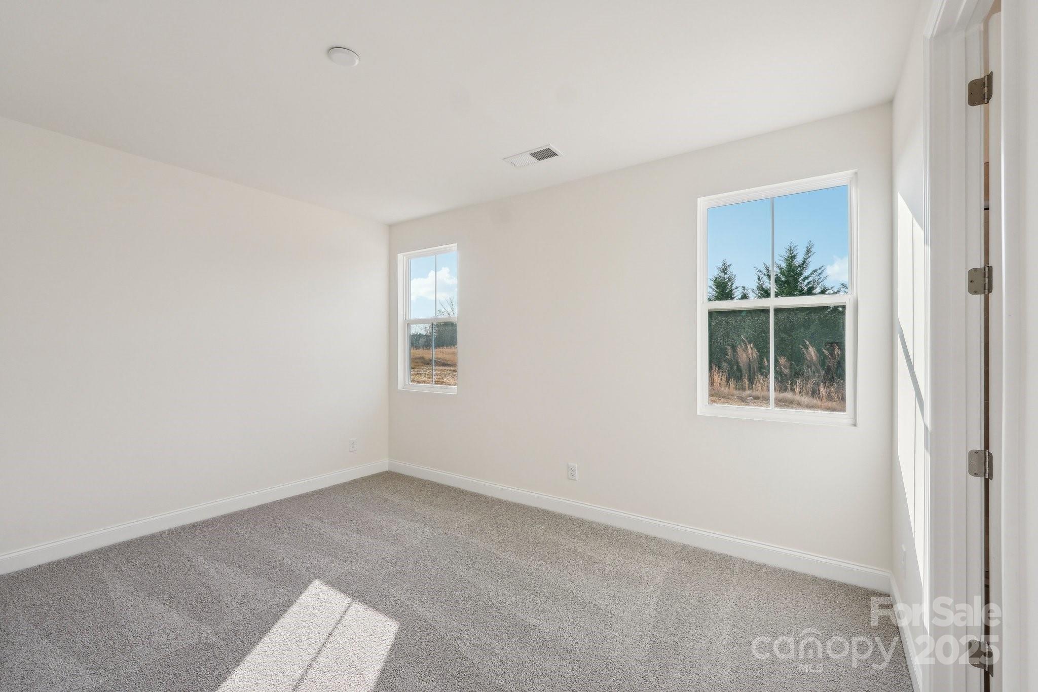 817 Terra Drive Tega Cay, SC 29708 - Photo 8 of 38 an empty room with windows and view