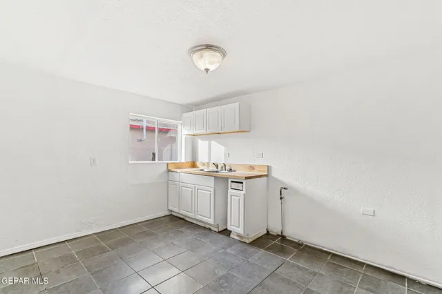 a kitchen with cabinets and sink