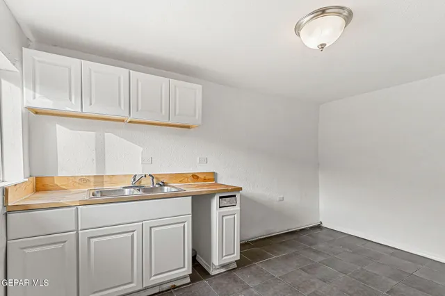 a kitchen with cabinets and appliances