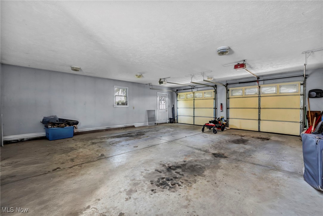 9827 Akron Road Rittman, OH 44270 - Photo 36 of 47 Garage featuring a garage door opener