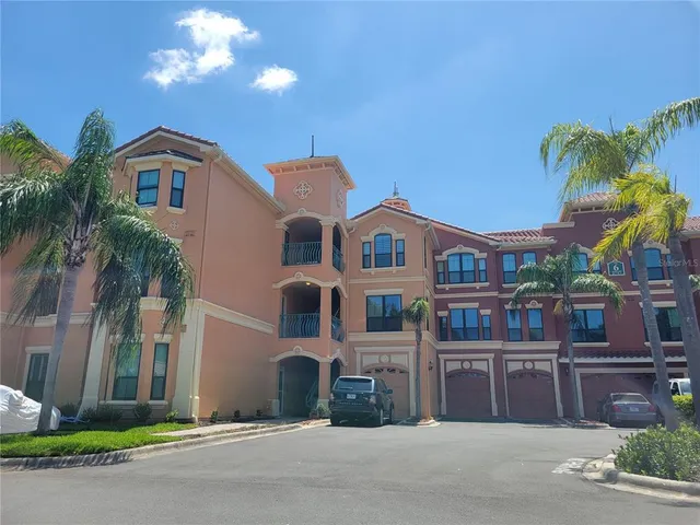 a view of multiple houses with a street