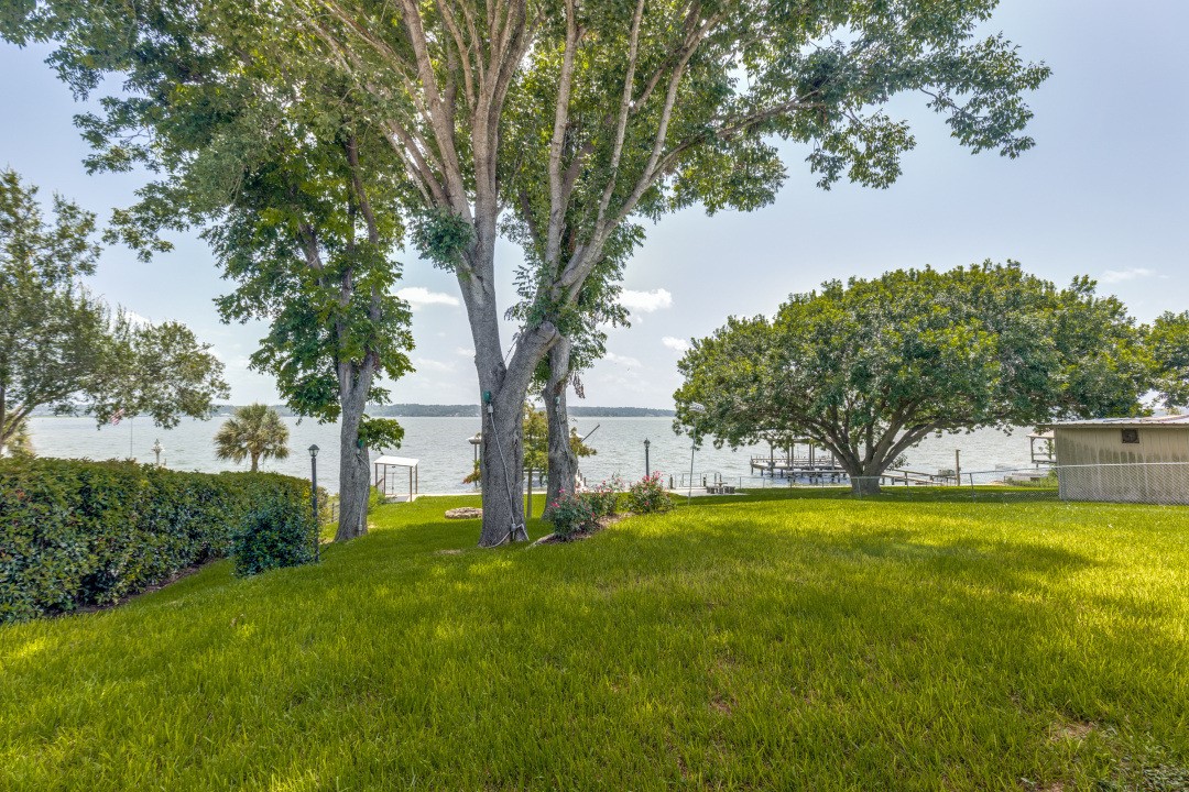 207 Vivian Road Onalaska, TX 77360 - Photo 4 of 34 a view of a swimming pool with a yard