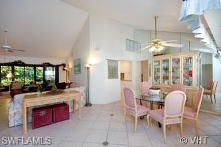 811 Reef Point Circle Naples, FL 34108 - Photo 4 of 8 a large kitchen with a table and chairs