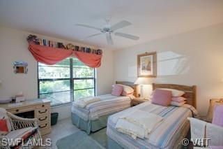 811 Reef Point Circle Naples, FL 34108 - Photo 8 of 8 a bedroom with two beds and a window