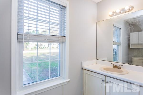 1925 Carthage Circle Raleigh, NC 27604 - Photo 8 of 15 a bathroom with a granite countertop sink and a mirror