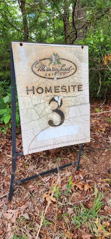a view of a wooden bench in a yard