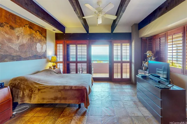 a large spacious bedroom with a large bed and a book shelf