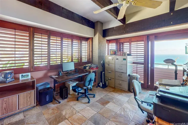 a room with furniture and air hockey table