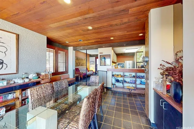 a living room with furniture and a book shelf