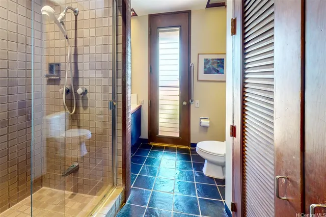 a bathroom with a glass door shower