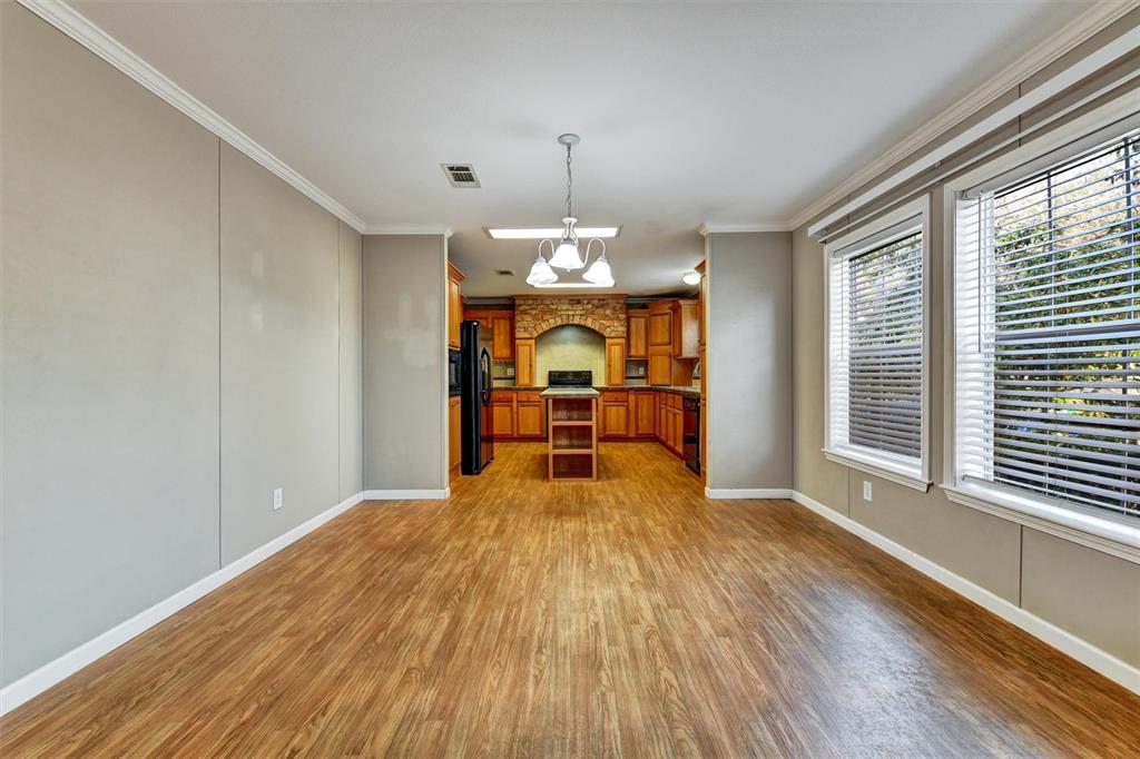 312 Aristides Street Dunedin, FL 34698 - Photo 16 of 38 a view of empty room with wooden floor and fan