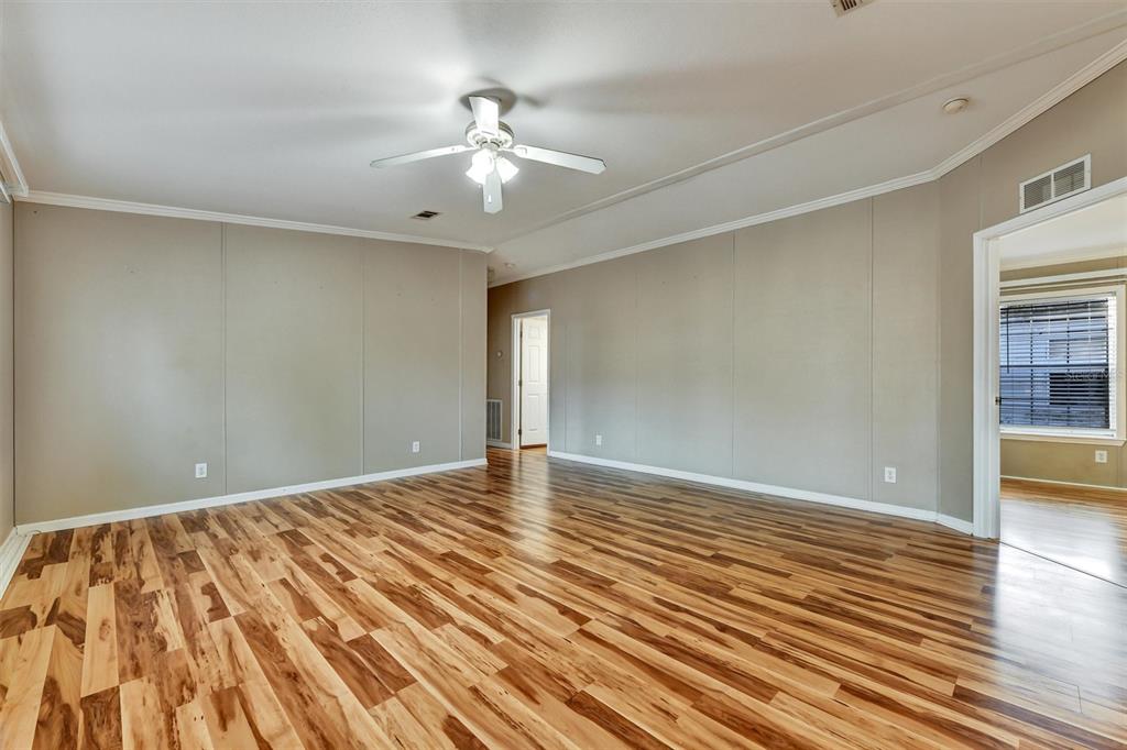 312 Aristides Street Dunedin, FL 34698 - Photo 17 of 38 a view of an empty room with wooden floor
