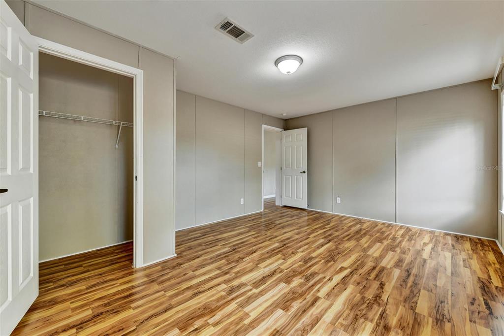 312 Aristides Street Dunedin, FL 34698 - Photo 29 of 38 a view of an empty room and wooden floor