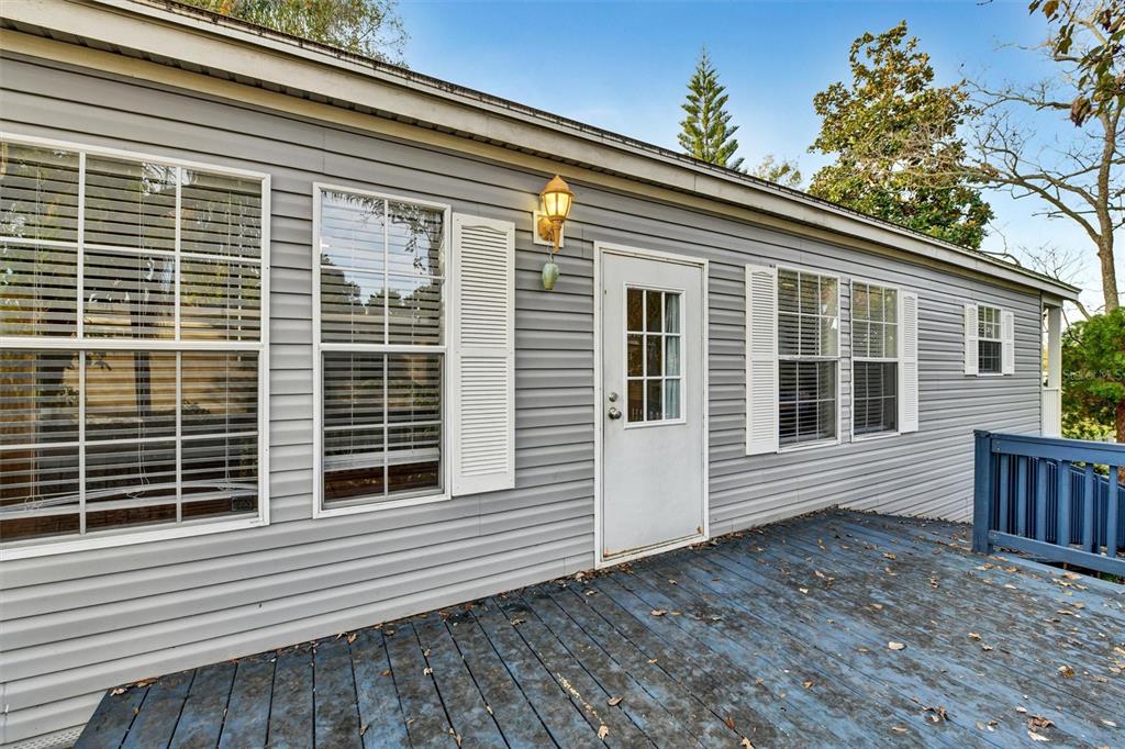 312 Aristides Street Dunedin, FL 34698 - Photo 31 of 38 a view of house with deck
