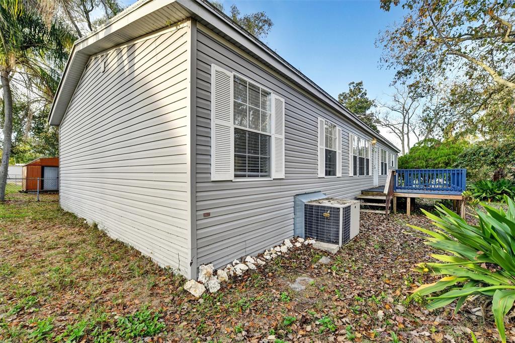 312 Aristides Street Dunedin, FL 34698 - Photo 32 of 38 a view of a house with a yard and sitting area