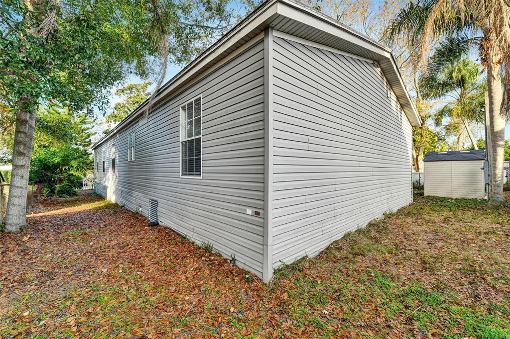 312 Aristides Street Dunedin, FL 34698 - Photo 34 of 38 a view of a house with a yard