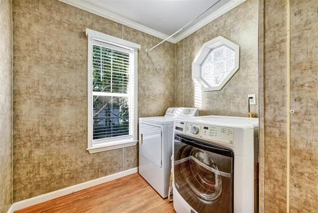 a kitchen with stainless steel appliances granite countertop wooden cabinets a sink and a counter space