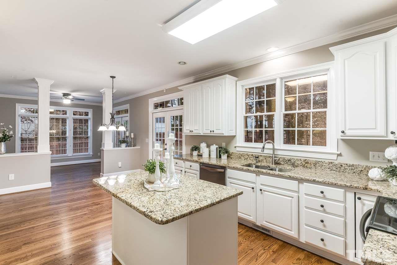 3712 Evander Way Raleigh, NC 27613 - Photo 2 of 13 Beautiful GRANITE counters in the updated kitchen. Stainless appliances, ISLAND, large PANTRY and refinished HARDWOODS! There is a nice breakfast area too and extended "living room" for plenty of space for family gatherings.