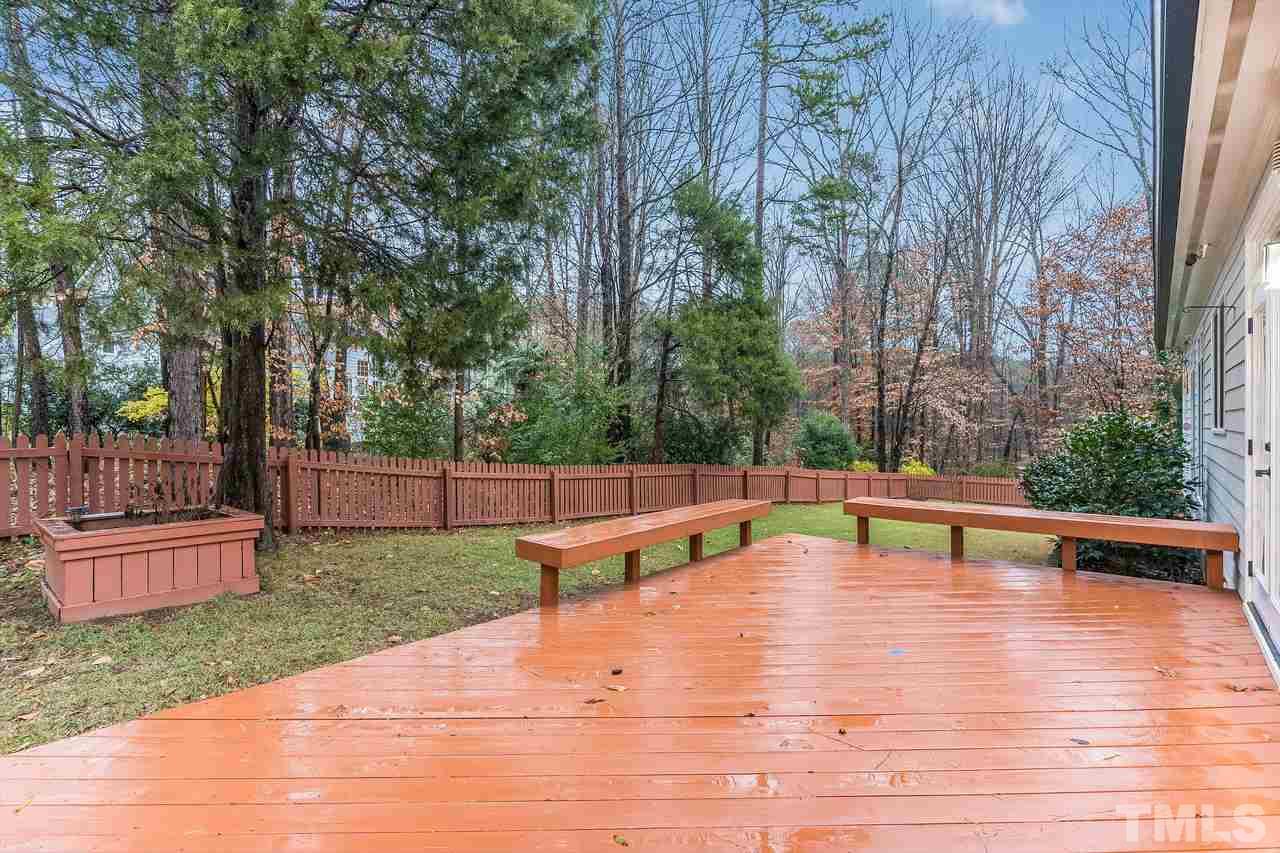 3712 Evander Way Raleigh, NC 27613 - Photo 11 of 13 The yard is FENCED and has this HUGE DECK! Plenty of space to enjoy the outdoors and this is a VERY PRIVATE lot, one of the best in the neighborhood!