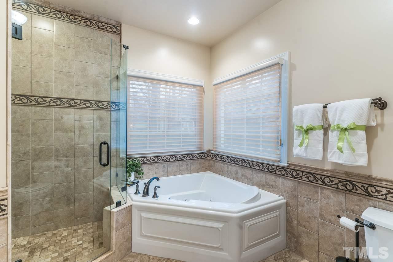 3712 Evander Way Raleigh, NC 27613 - Photo 7 of 13 Large GARDEN tub is the perfect spot for relaxing after a long day! The tile shower is spacious too.