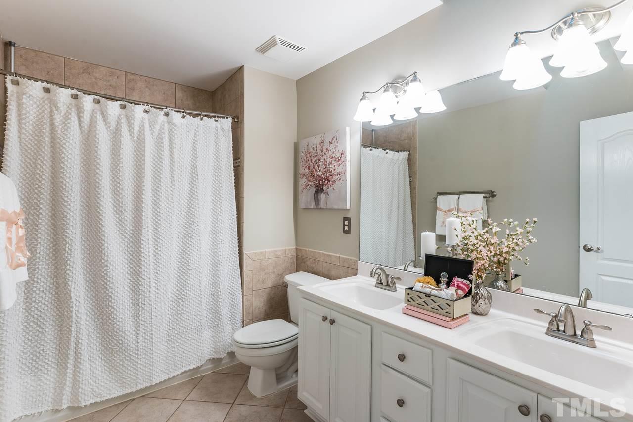 3712 Evander Way Raleigh, NC 27613 - Photo 9 of 13 Updated full bath, everything's been painted, all new carpet, refinished hardwoods, nothing to do but move in!