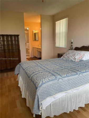 a bedroom with a bed and a walk in closet