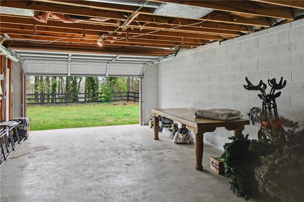112 Maple Drive Cartersville, GA 30120 - Photo 103 of 105 a view of a patio with a table and chairs under an umbrella
