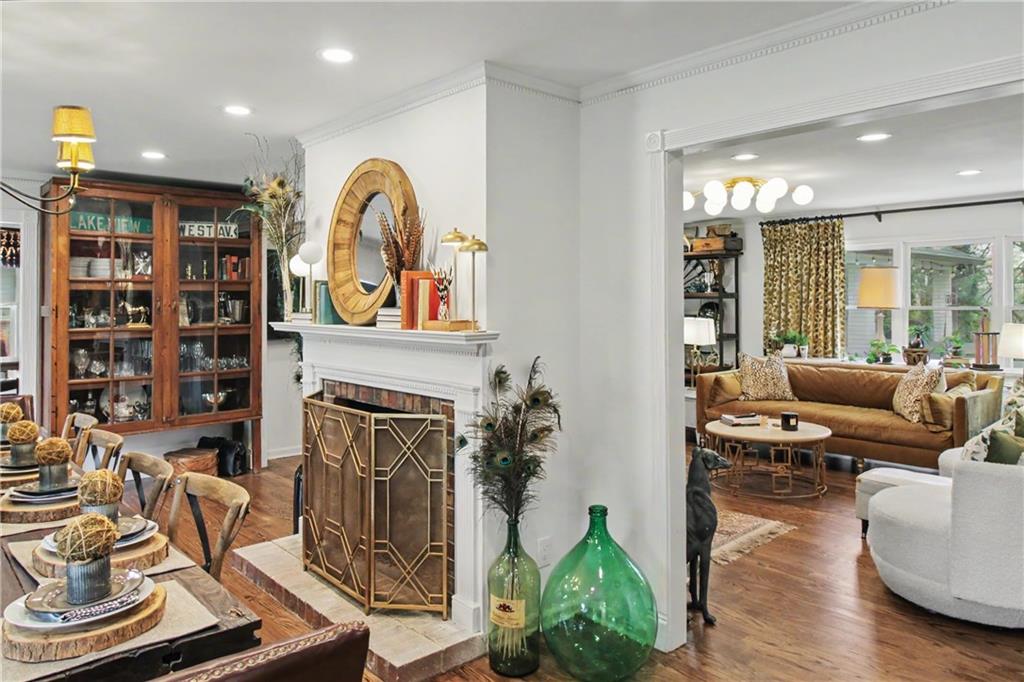 112 Maple Drive Cartersville, GA 30120 - Photo 21 of 105 a living room with furniture a fireplace and a potted plant