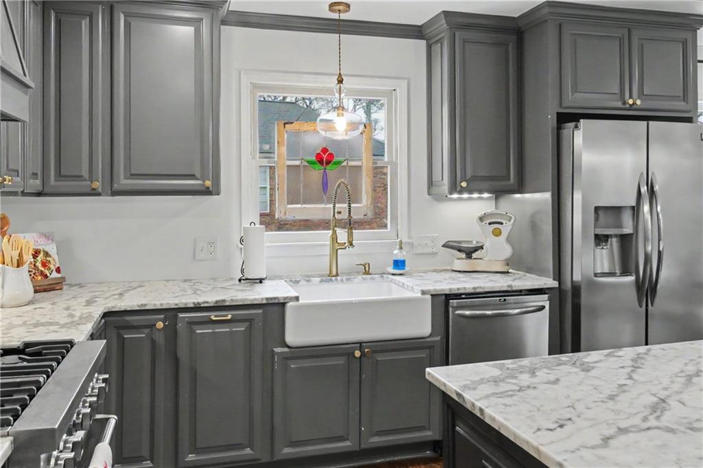 112 Maple Drive Cartersville, GA 30120 - Photo 47 of 105 a kitchen with stainless steel appliances granite countertop a sink stove and refrigerator
