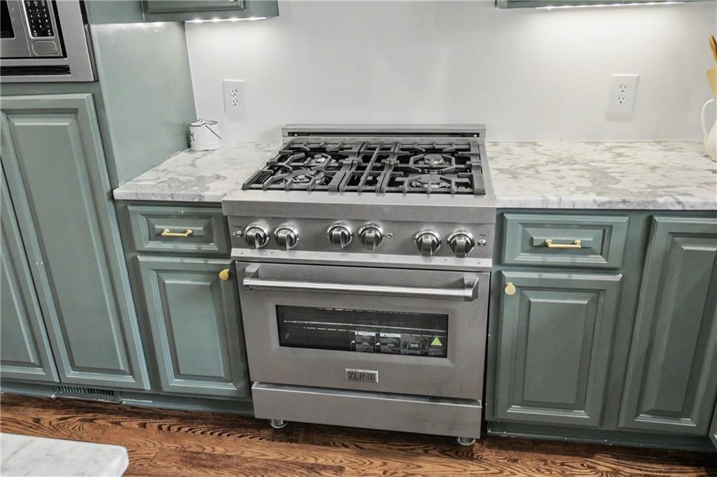 112 Maple Drive Cartersville, GA 30120 - Photo 51 of 105 a stove top oven sitting inside of a kitchen