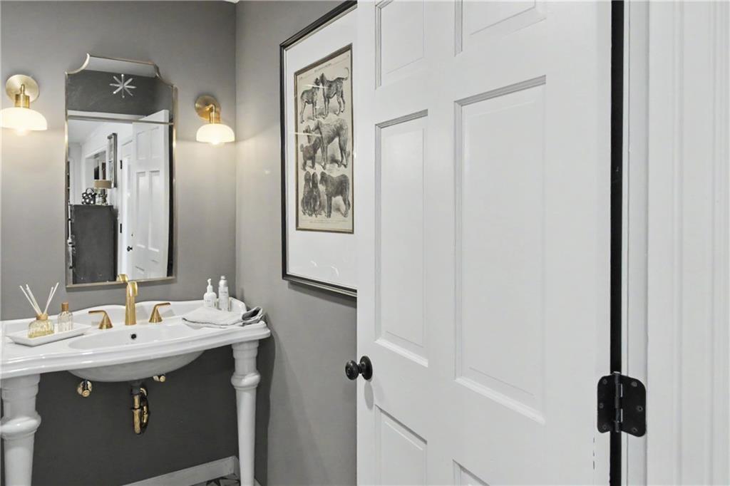 112 Maple Drive Cartersville, GA 30120 - Photo 59 of 105 a bathroom with a sink and a mirror