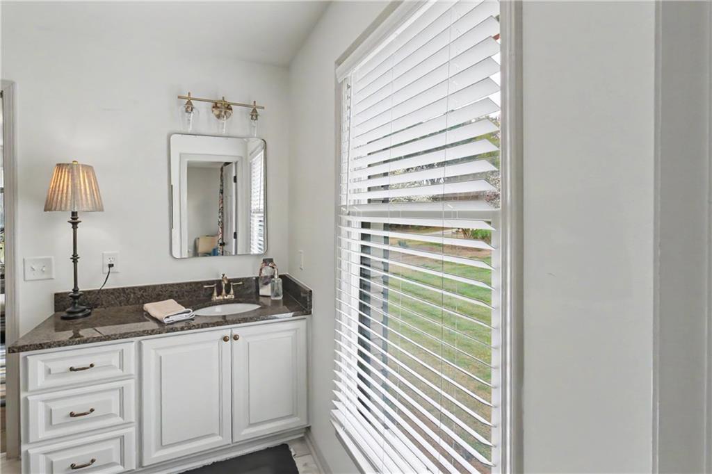 112 Maple Drive Cartersville, GA 30120 - Photo 87 of 105 a bathroom with a sink and a mirror
