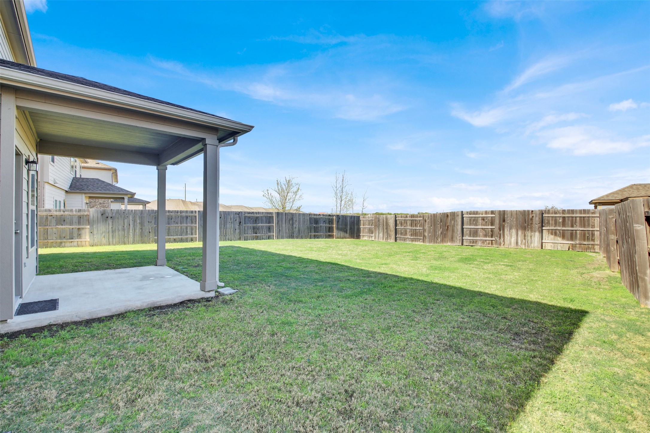 13716 Sugar Bush Path Manor, TX 78653 - Photo 6 of 37 Fenced backyard featuring a patio