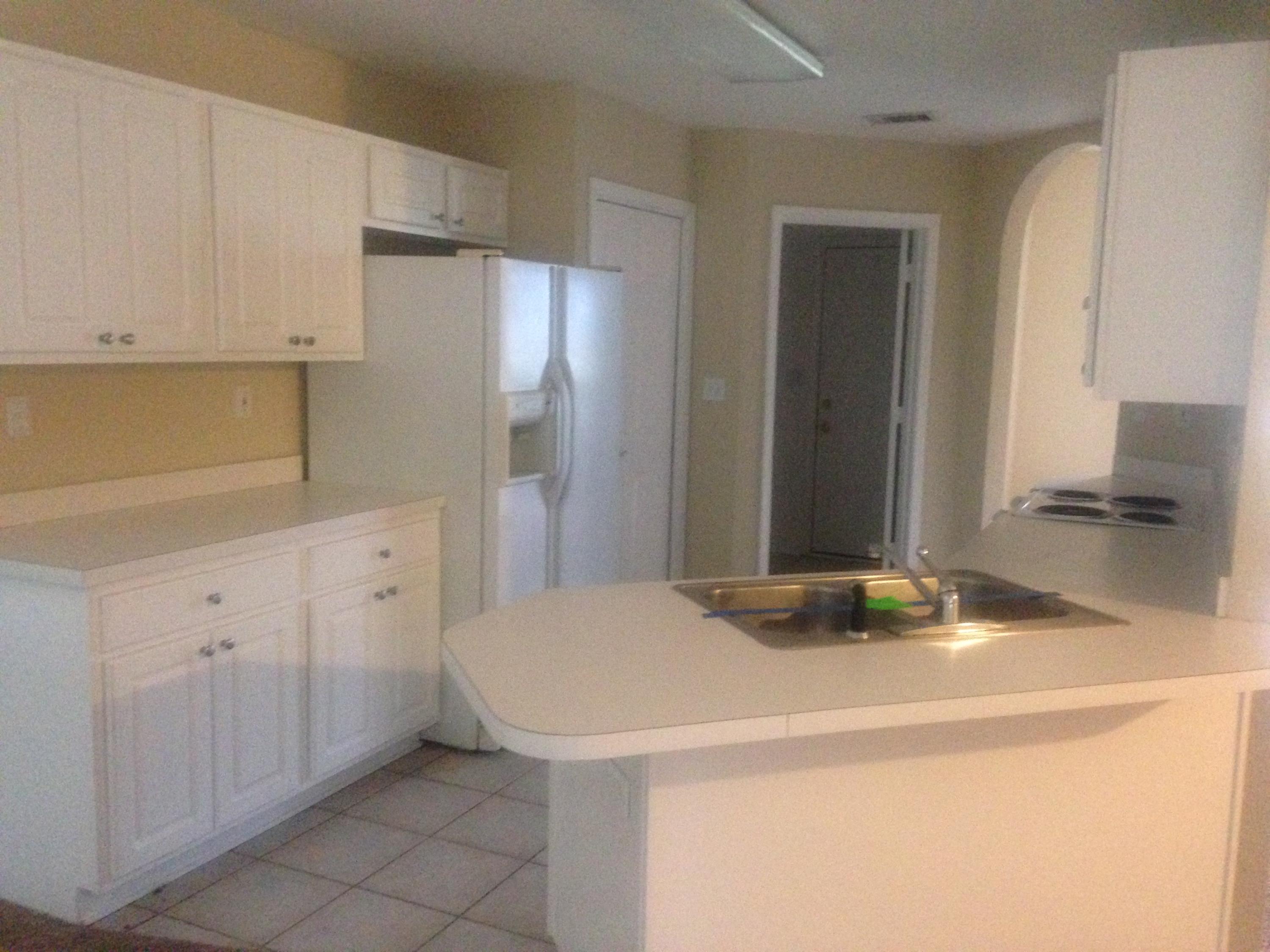 5973 Old Bethel Road Crestview, FL 32536 - Photo 7 of 18 a kitchen with a sink and cabinets
