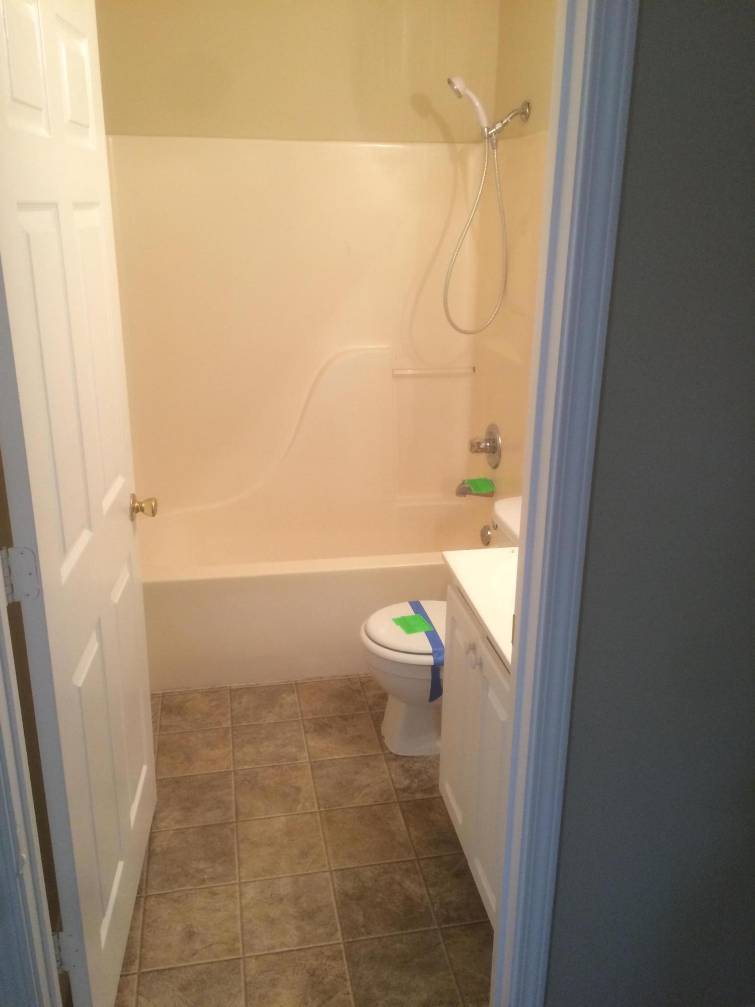 5973 Old Bethel Road Crestview, FL 32536 - Photo 9 of 18 a bathroom with a granite countertop shower and a toilet