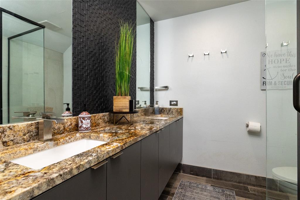 205 Timberlake Drive Azle, TX 76020 - Photo 25 of 40 a bathroom with a granite countertop sink and a mirror