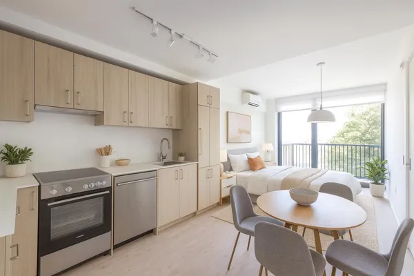 a kitchen with stainless steel appliances granite countertop a stove a sink dishwasher and white cabinets with wooden floor
