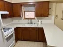a kitchen with a refrigerator and a sink