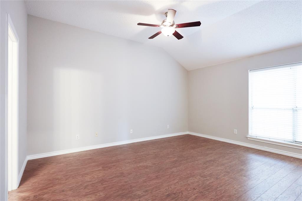 8112 Dock Street Frisco, TX 75035 - Photo 19 of 34 an empty room with a window and ceiling fan