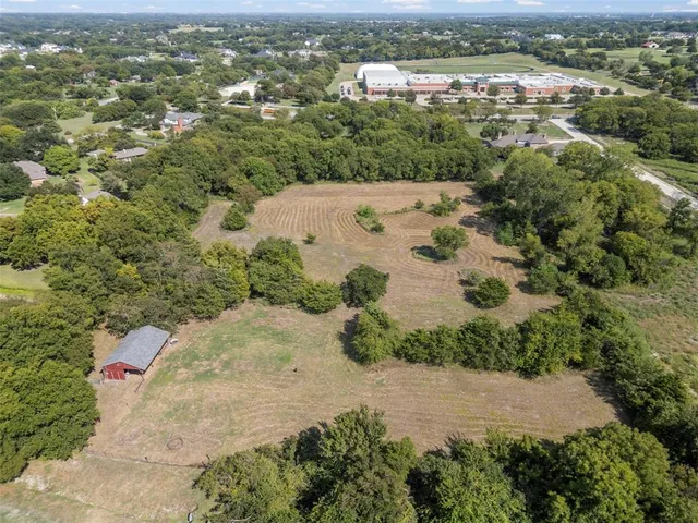 an aerial view of a houses with outdoor space