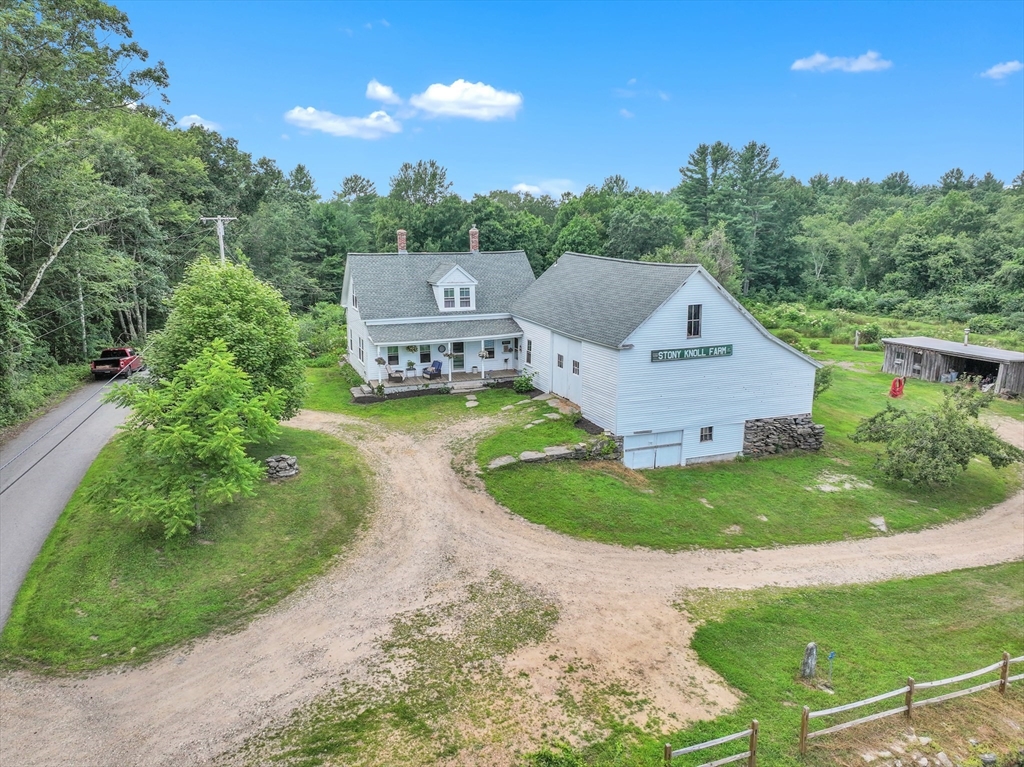 665 Thresher Road Hardwick, MA 01037 - Photo 1 of 41 an aerial view of a house with garden space and trees