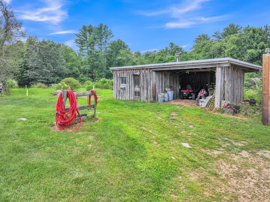 665 Thresher Road Hardwick, MA 01037 - Photo 13 of 41 a view of a house with backyard and entertaining space