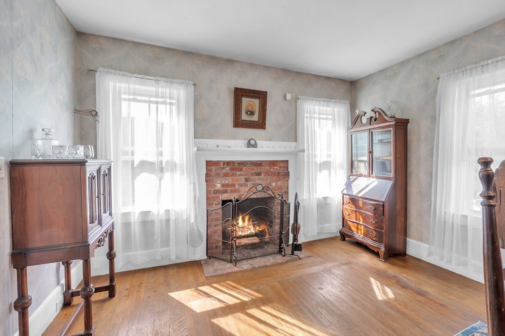 665 Thresher Road Hardwick, MA 01037 - Photo 22 of 41 a living room with furniture and a fireplace