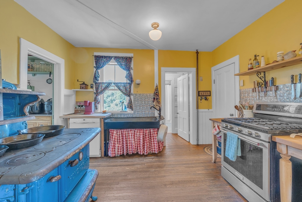 665 Thresher Road Hardwick, MA 01037 - Photo 24 of 41 a kitchen with stainless steel appliances granite countertop a stove and a sink