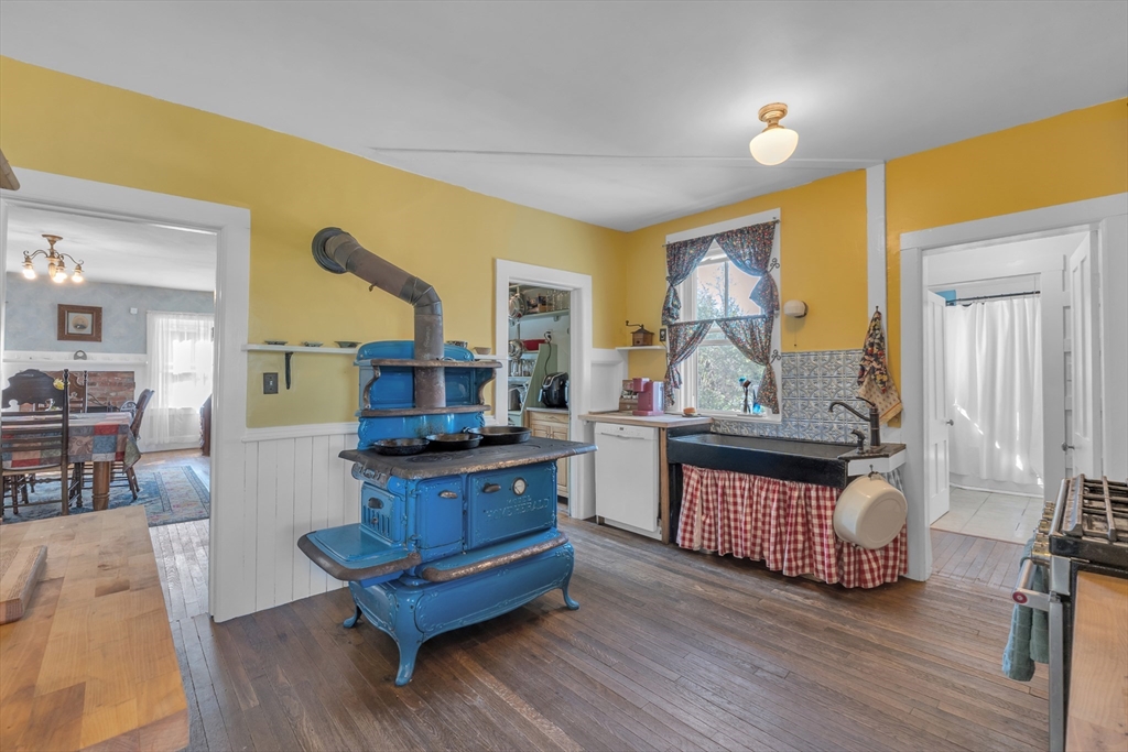 665 Thresher Road Hardwick, MA 01037 - Photo 26 of 41 a living room with furniture and a wooden floor